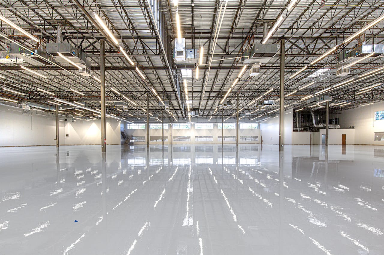 Spacious and polished industrial facility with glossy epoxy flooring in Houston, Texas.